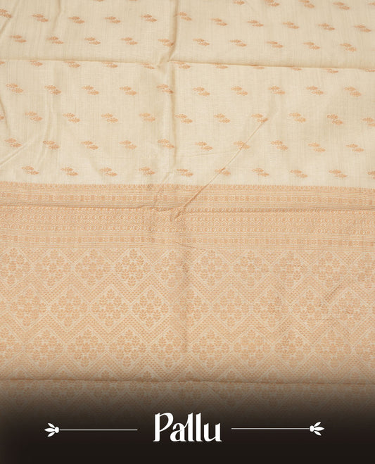 Cream colour tussar saree featuring litte gold zari motifs on body, Self colour border and pallu with zari woven design, comes with matching blouse piece.