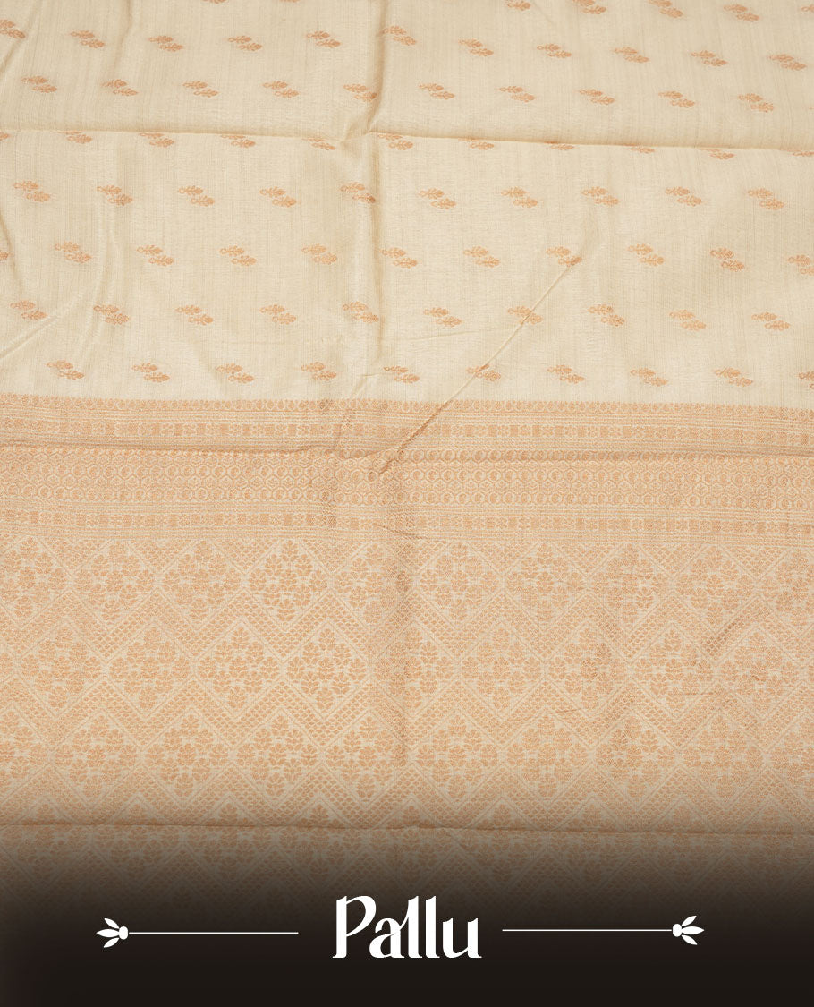 Cream colour tussar saree featuring litte gold zari motifs on body, Self colour border and pallu with zari woven design, comes with matching blouse piece.