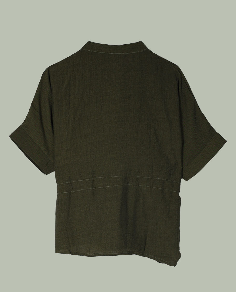 Olive green short-sleeve top with V-slit band neckline, contrast ivory crochet motif on one side, and adjustable drawstring detail at the waist.