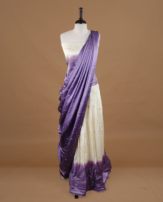Off White colour half saree material featuring delicate zari buttas on the blouse and skirt, paired with a contrast Lavender zari border and matching small zari motifs dupatta