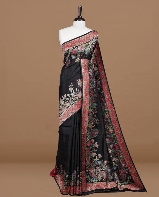 Black colour pashmina saree featuring Multi colour floral kodi & peacock leaf patterned border and pallu, paired with matching blouse piece.