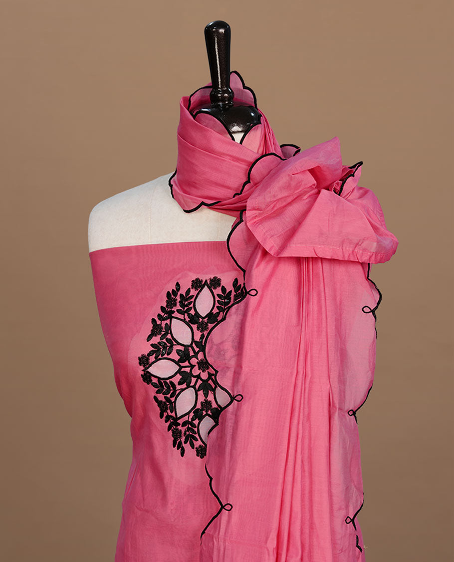 Pink colour churidari material featuring black thread pattern on body, paired with matching bottom and dupatta.