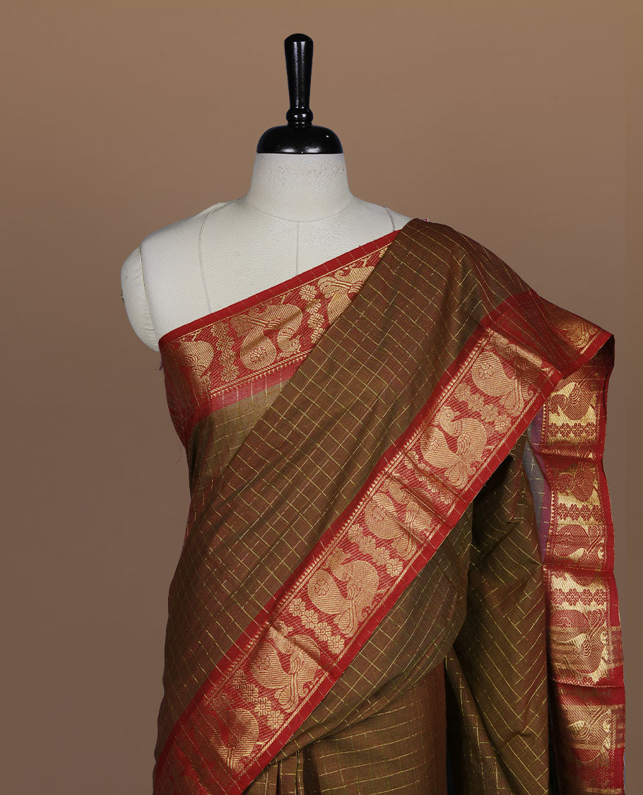 Olive brown colour sungudi cotton saree featuring gold zari check pattern across body, contrast Maroon colour with gold zari peacock and floral pattern on border, without blouse piece.