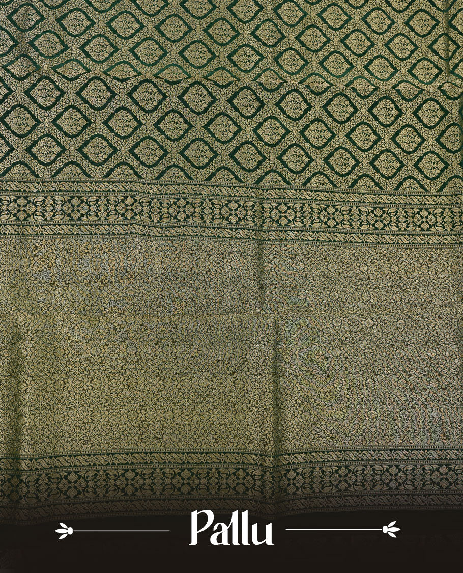 Dark green colour banaras satin crepe saree featuring gold zari pattern across body, with self colour border with gold zari pattern and paired with matching blouse.