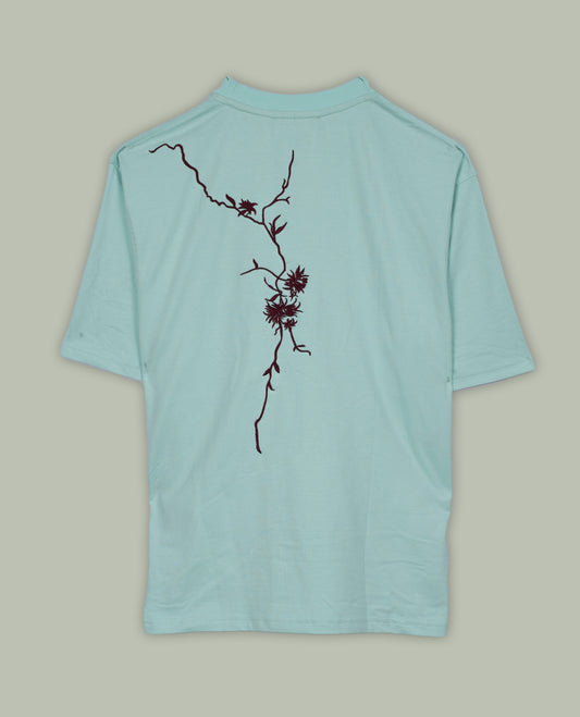 Sky blue colour T shirt featuring intricate wine coloured embroidery on the front and back, designed with a classic round neck and short sleeves & it offers a stylish and comfortable everyday look.