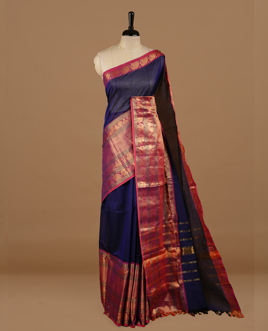 Navy blue colour chettinad cotton saree featuring Elegant plain body, complemented by magenta colour with traditional border, paired with matching blouse piece.