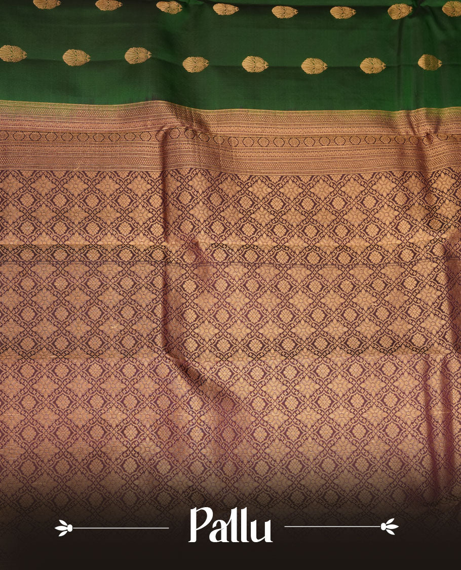 Green colour Vasundhara silk saree featuring gold zari buttas on body, complemented by contrast burgundy colour zari border, paired with matching blouse piece.