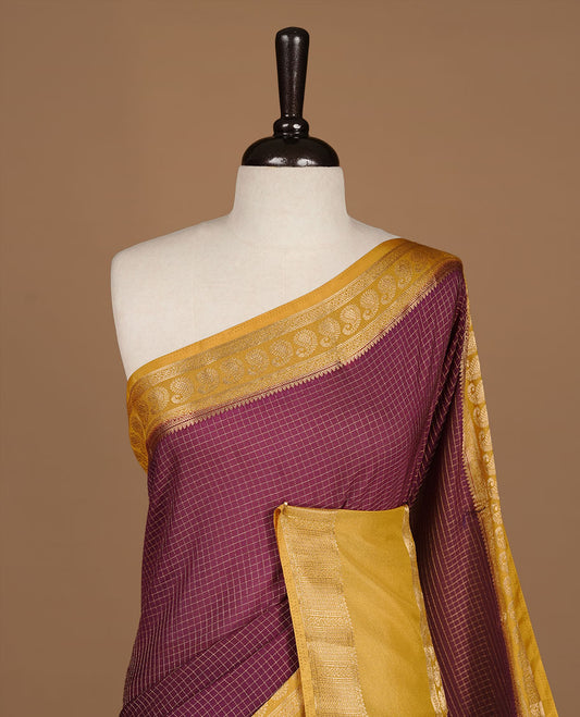 Maroon colour semi georgette saree featuring gold zari check pattern on body, complemented by contrast olive colour with zari border, paired with matching blouse piece.