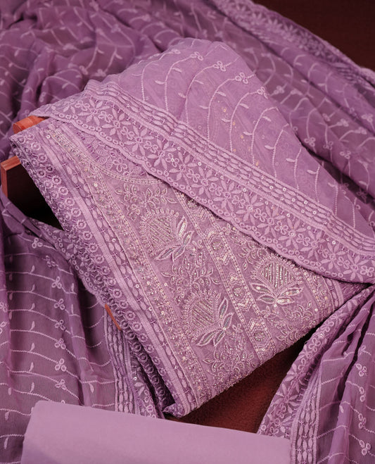 Lavender colour churidhar Material featuring Intricate Thread Embroidery with Mirror and Cut Beads Work on the Front Panel, paired with an All Over Embroidered Net Dupatta and Matching Bottom