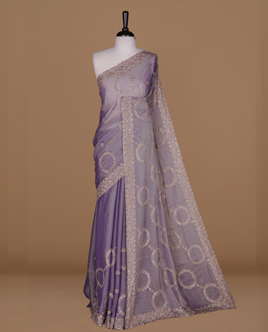 Lavender colour organza saree featuring thread & gold stone pattern on body, highlighting scalp border, paired with matching blouse piece.