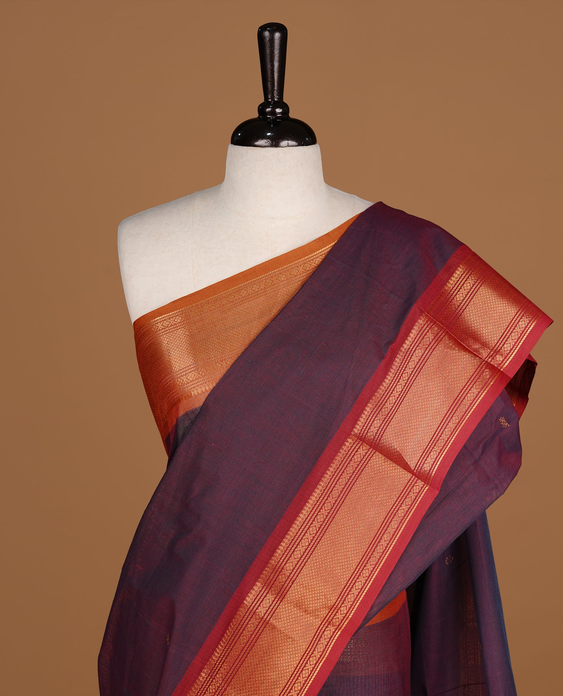 Teal & maroon colour Chettinad cotton saree featuring gold zari motifs body, complemented by contrast Maroon colour with gold zari border, paired with matching blouse piece.