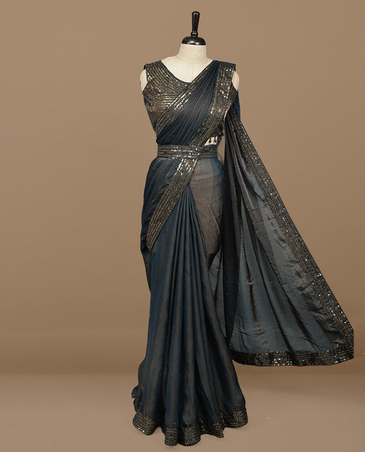 Gold & blue double shade designer saree features Elegant plain body, highlights Sequins & cut beats on border, paired with ready made blouse.