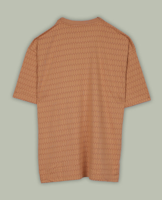 Pastel orange colour T shirt featuring a honeycomb textured pattern, designed with a classic round neck and short sleeves, made from soft breathable fabric for a relaxed and stylish everyday look.