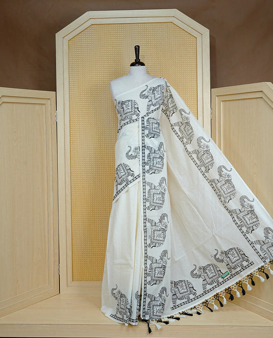 Cream colour Cotton kerala saree featuring Elegant plain body, complemented by Elephant print border, comes with matching blouse piece.