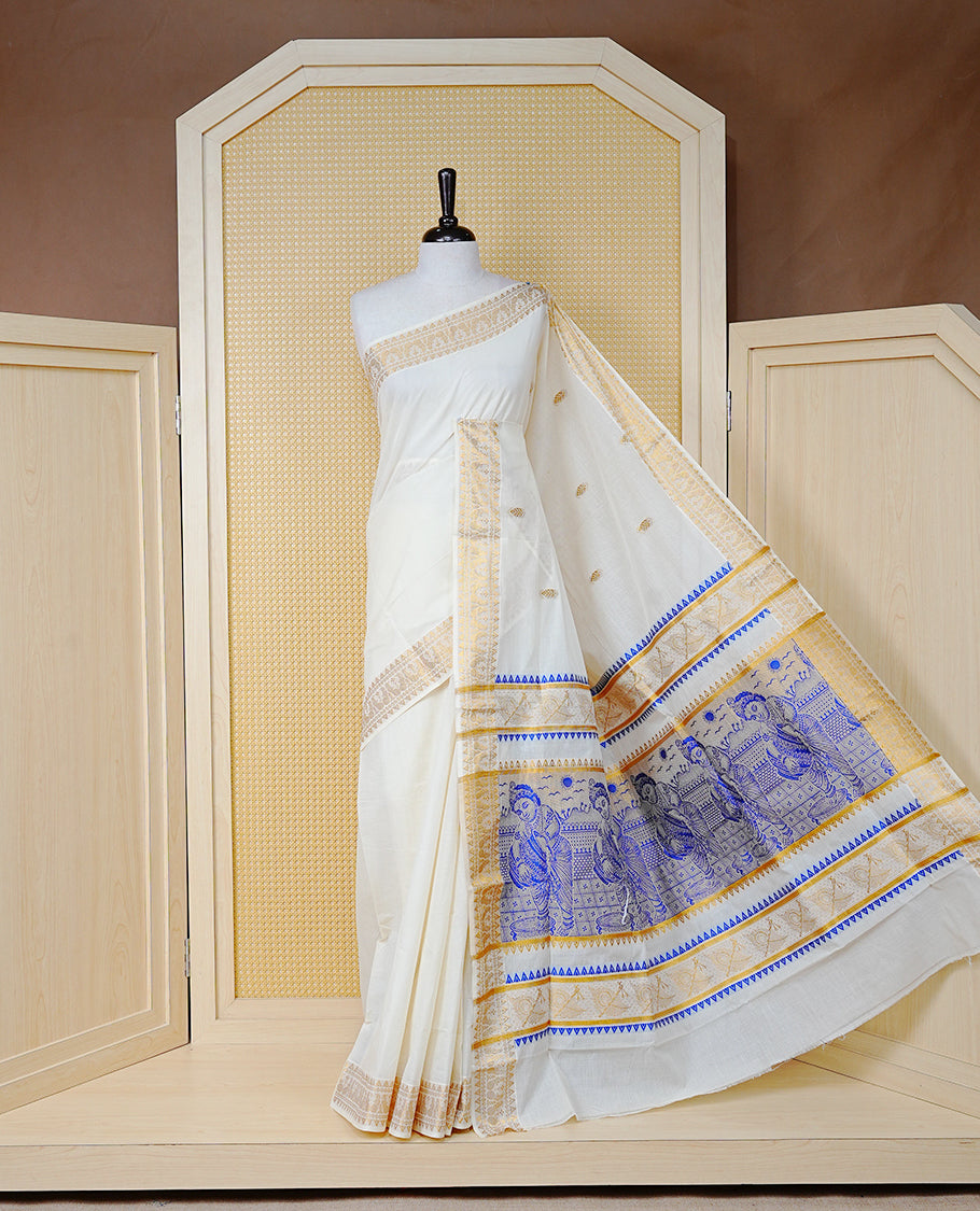 Cream Colour Cotton Kerala Saree Featuring Gold Buttas on the Body, a Classy Gold Zari Border, and a Traditional Blue Colour Lord Krishna Thread work and Gold Zari Pallu, Paired with a Matching Blouse Piece.