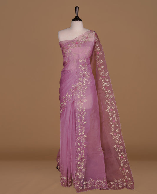 Dusty Pink colour crush organza saree featuring gold thread floral and stone worked body, highlighting scalp designed border, paired with matching blouse piece.