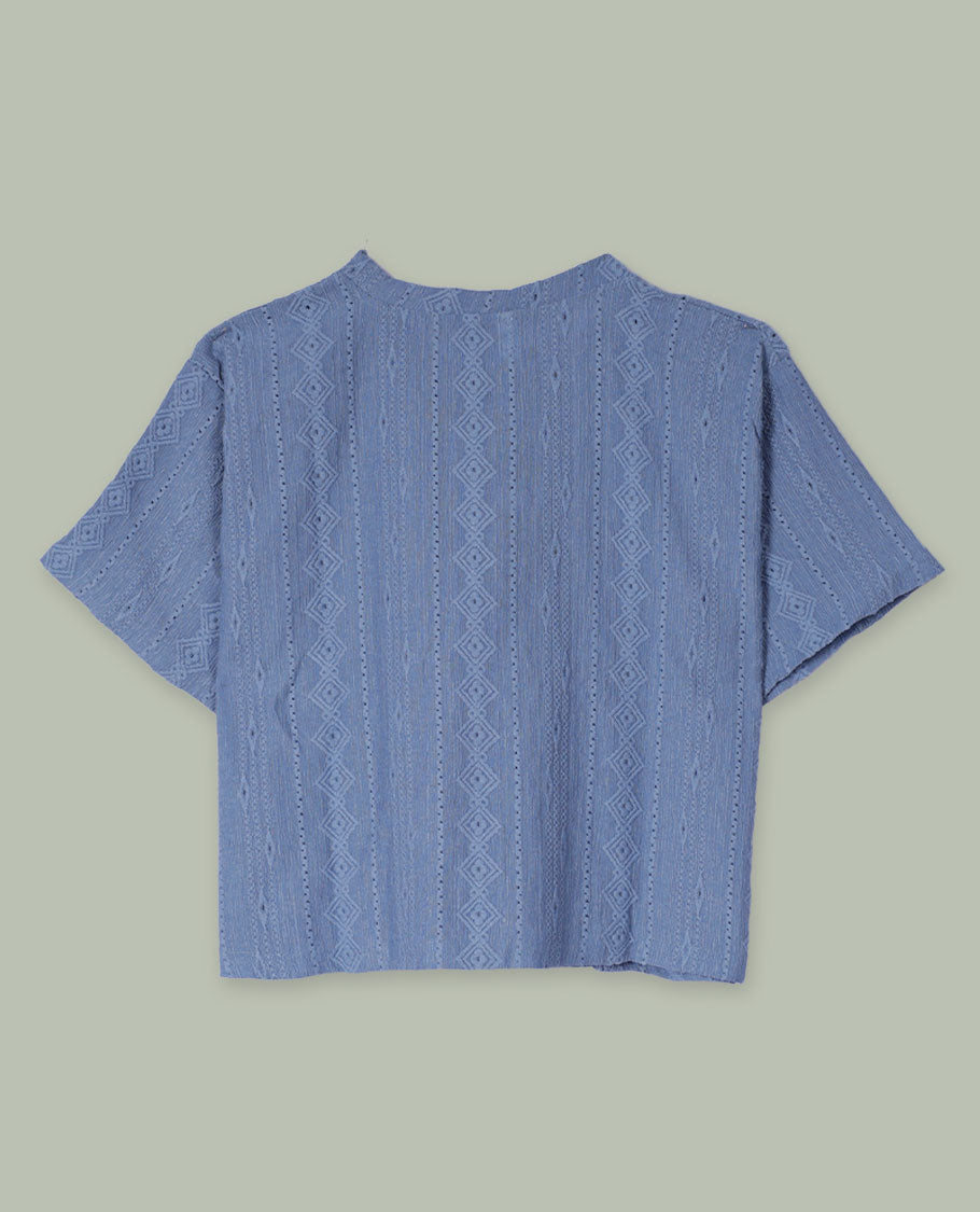 Dusty blue textured short-sleeve top with round neckline and subtle vertical geometric jacquard pattern all over.