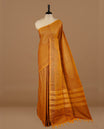 Mustard colour chettinad cotton saree featuring check pattern on body, complemented by self colour without border, paired with matching blouse piece.