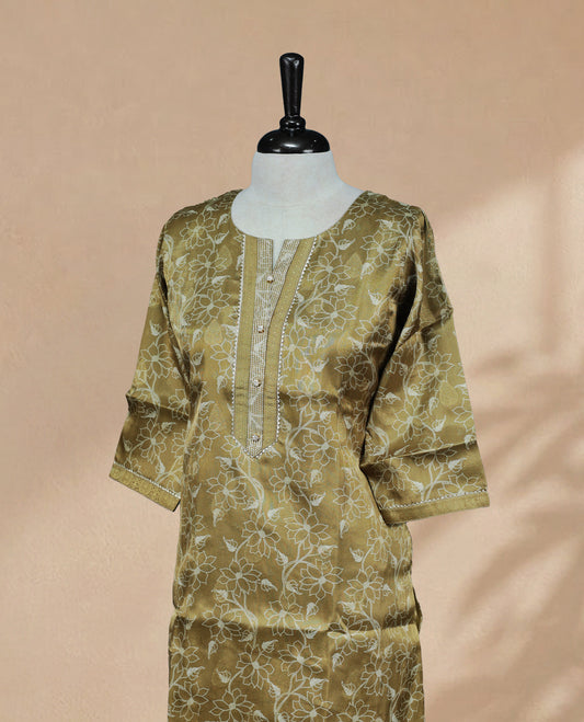 Olive colored tissue Kurti featuring gold circle motifs on the body, a U-shaped neckline adorned with thread and bead detailing, and 3/4 sleeves.