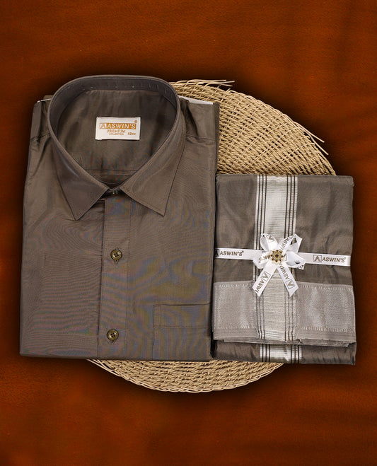 Copper colour Aswin’s wedding set featuring a premium silk finish full sleeve shirt, paired with a matching dhoti and angavastram accented with elegant silver zari work, ideal for festive and wedding occasions