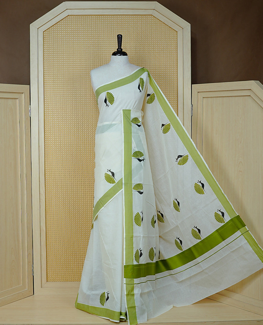 Cream colour Cotton Kerala saree Featuring Classy Plain body for Effortless Elegance, enhancing Green with Peacock Printed border, paired with matching blouse piece.