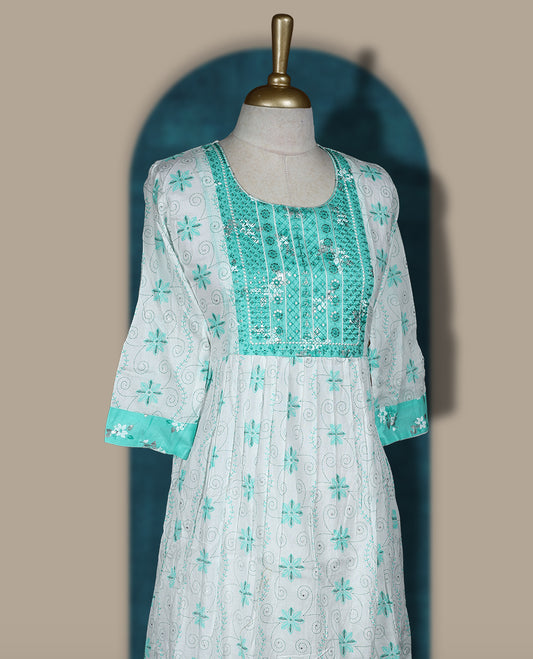 White and aqua green kurti featuring delicate floral embroidery, a square neckline, 3/4 sleeves, and a flared hem & Perfect for casual outings or festive wear with its breezy, stylish look.