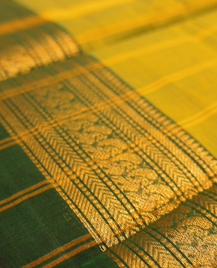 Lemon yellow with dark green dual tone colour chettinad cotton saree with traditional gold zari border without blouse piece.