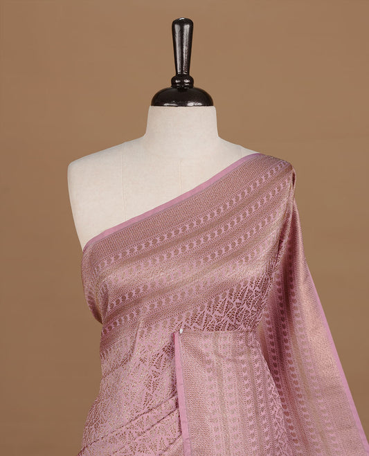 Pink colour Semi Banaras Katan saree featuring Antique zari Floral pattern on body, complemented by self colour zari border, paired with matching blouse piece.