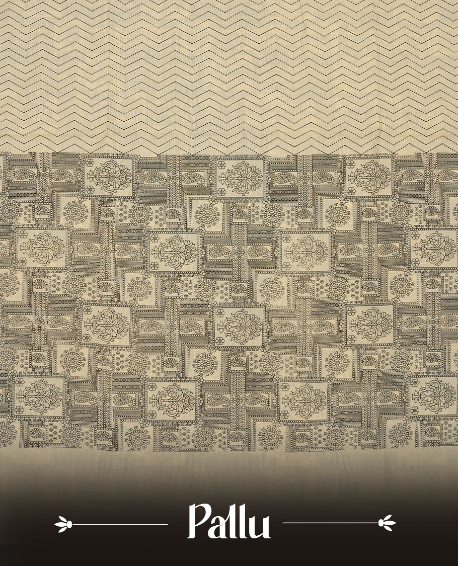 Cream colour poly cotton saree with black zigzag line pattern on the body, paired with a matching pallu featuring black chevron lines and panelled floral‑paisley design, and a coordinated all‑over floral paisley patch‑style printed blouse piece.