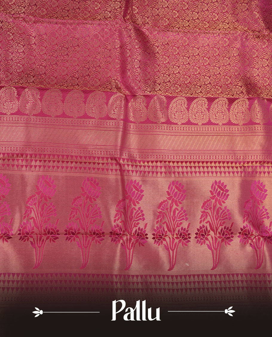 Magenta pink colour kancheepuram silk saree featuring floral zari jacquard on body with traditional border, paired with matching blouse piece.