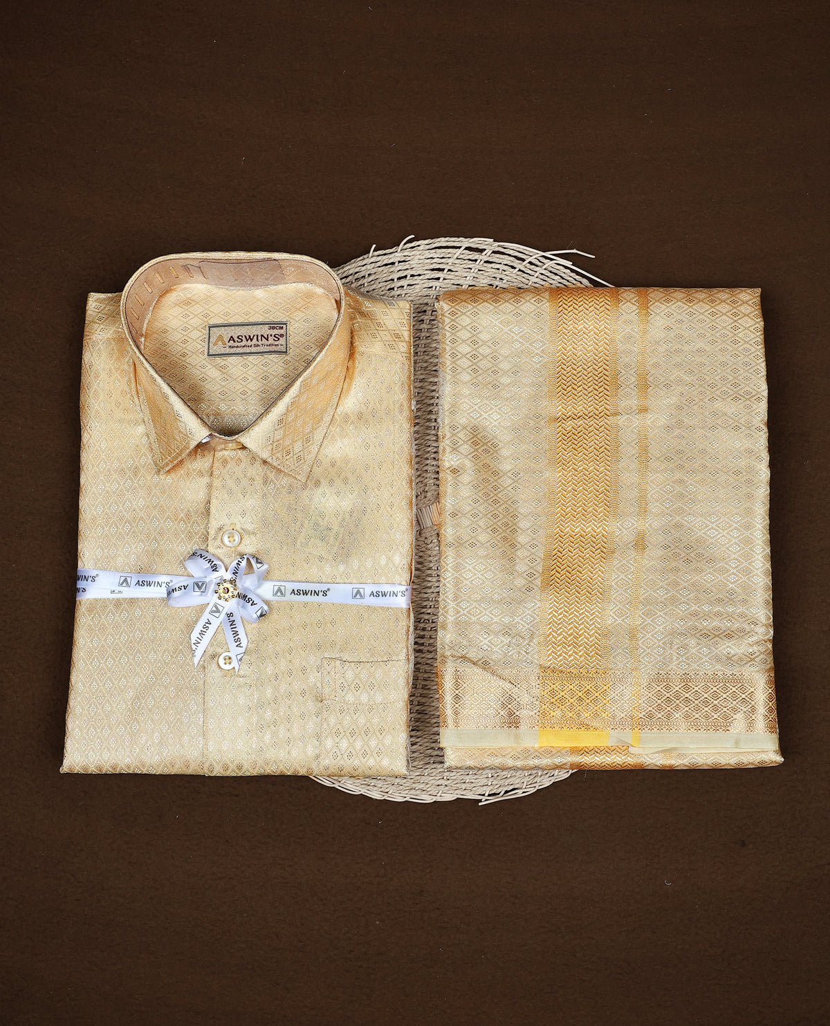 Light Gold colour  ASWIN'S shirt paired with a matching dhoti, finishing with a Gold kara