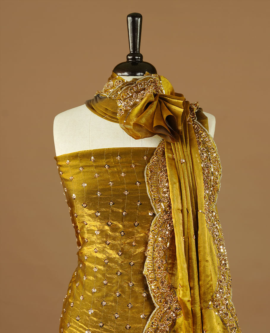 Olive colour churidhar material featuring cut beads and sequins work on the body, paired with a matching unstitched bottom and worked dupatta.
