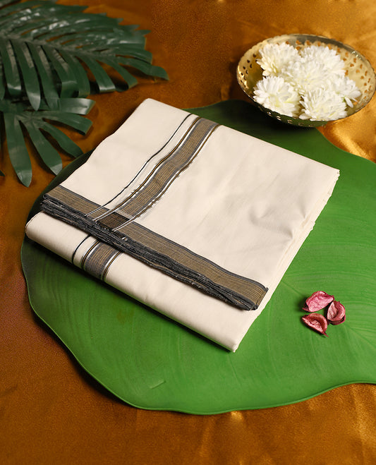 Refined off white colour pure handloom cotton double dhoti, enhanced with an elegant grey, black and silver zari border & A versatile and dignified attire, ideal for traditional ceremonies, weddings, and cultural festivities.