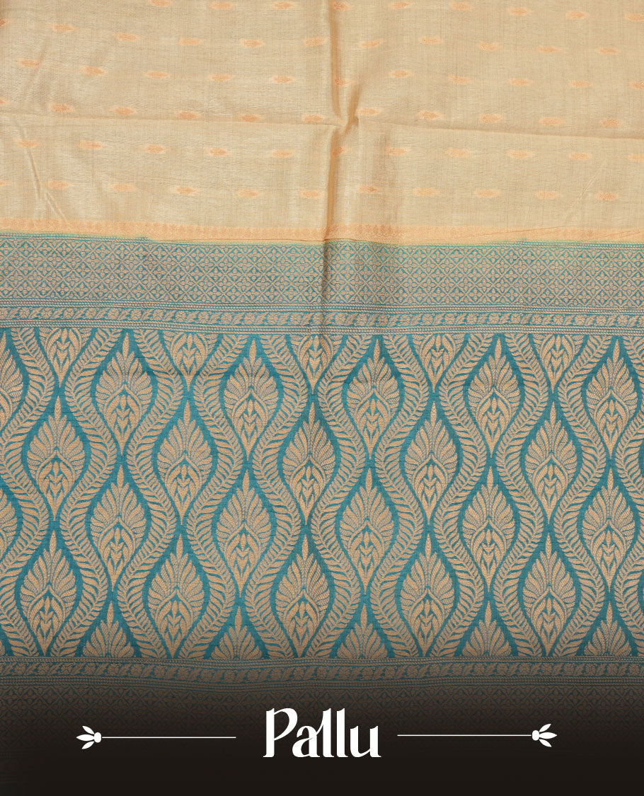 Light gold colour semi tussar saree featuring gold zari buttas across body, contrast teal colour gold zari border and comes with matching blouse piece.