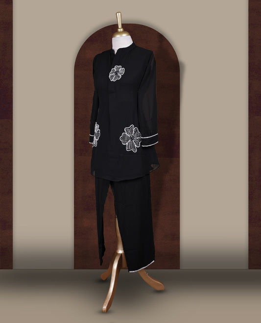 Black colour coord set featuring elegant pearls and cut beads floral embroidery work, mandarin collar, and sheer 3/4 sleeves, Paired with matching pants, it offers a sleek, modern look perfect for refined casual wear.