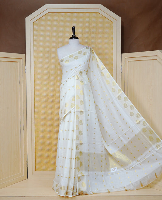 Cream Colour Cotton Kerala Saree Featuring Gold Zari Dot Motifs Across the Body, Enhanced with a Gold Zari Border and Traditional Gold Zari Pallu, Paired with Matching a Blouse Piece