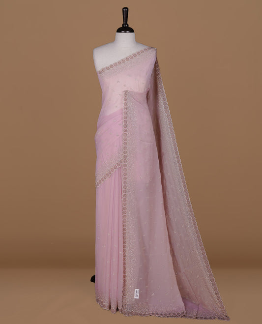 Pink colour designer saree featuring gold & white stone worked body and border, paired with matching blouse piece.