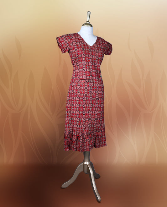 Red colour nightwear with intricate circular patterns in beige and black, Designed with a V neckline, short sleeves, and a flared hemline. Ideal for casual outings, workwear, or ethnic inspired looks.
