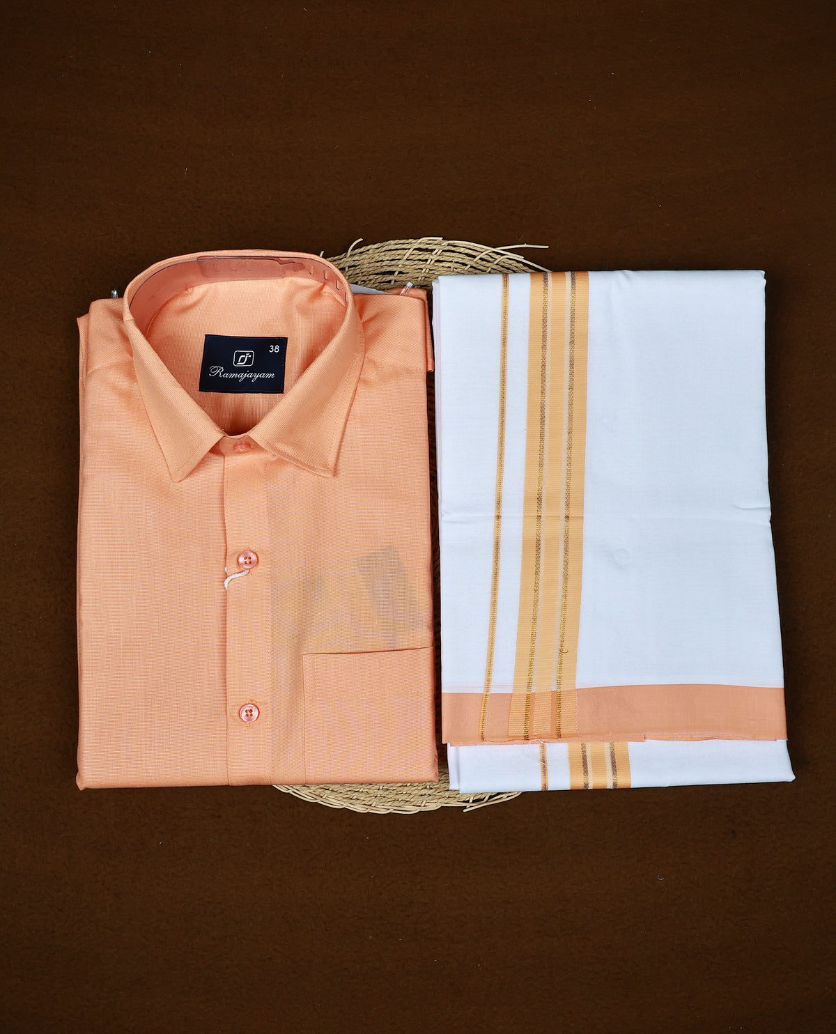 Orange colour RAMAJAYAM shirt paired with a matching dhoti, finishing with a orange kara