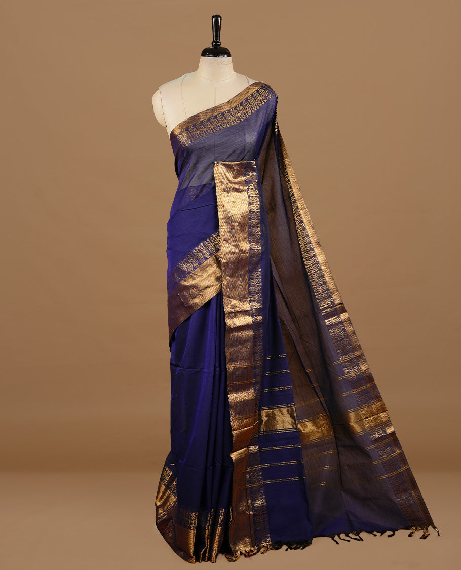 Navy blue colour chettinad cotton saree featuring elegant plain body, complemented by self colour with zari border, paired with matching blouse piece.