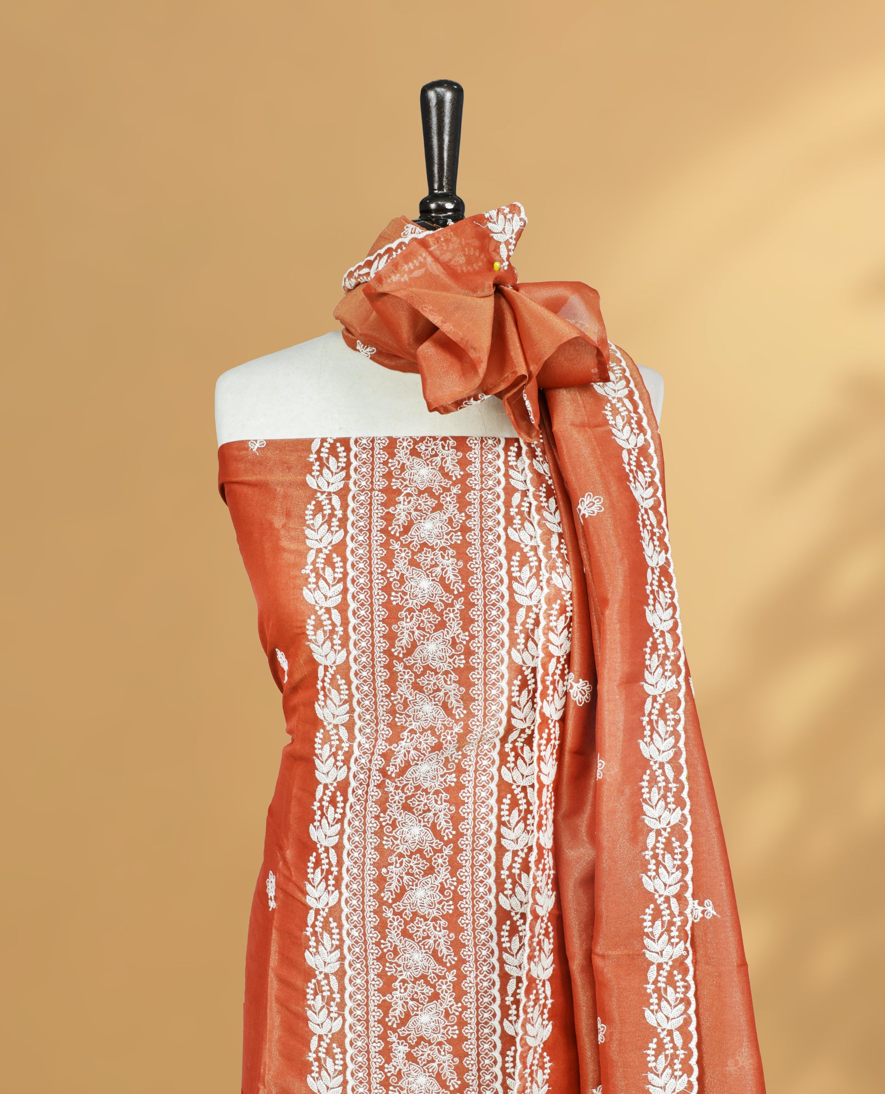 Rust Orange Colour Salwar Material Featuring Cream colour Thread Pattern on body, paired with Matching bottom & Elegant Dupatta.