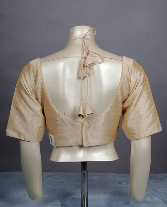 Light Cream colour silk padded readymade blouse with elbow-length sleeves, a V-neck front, and a deep U-back with tie-up dori.