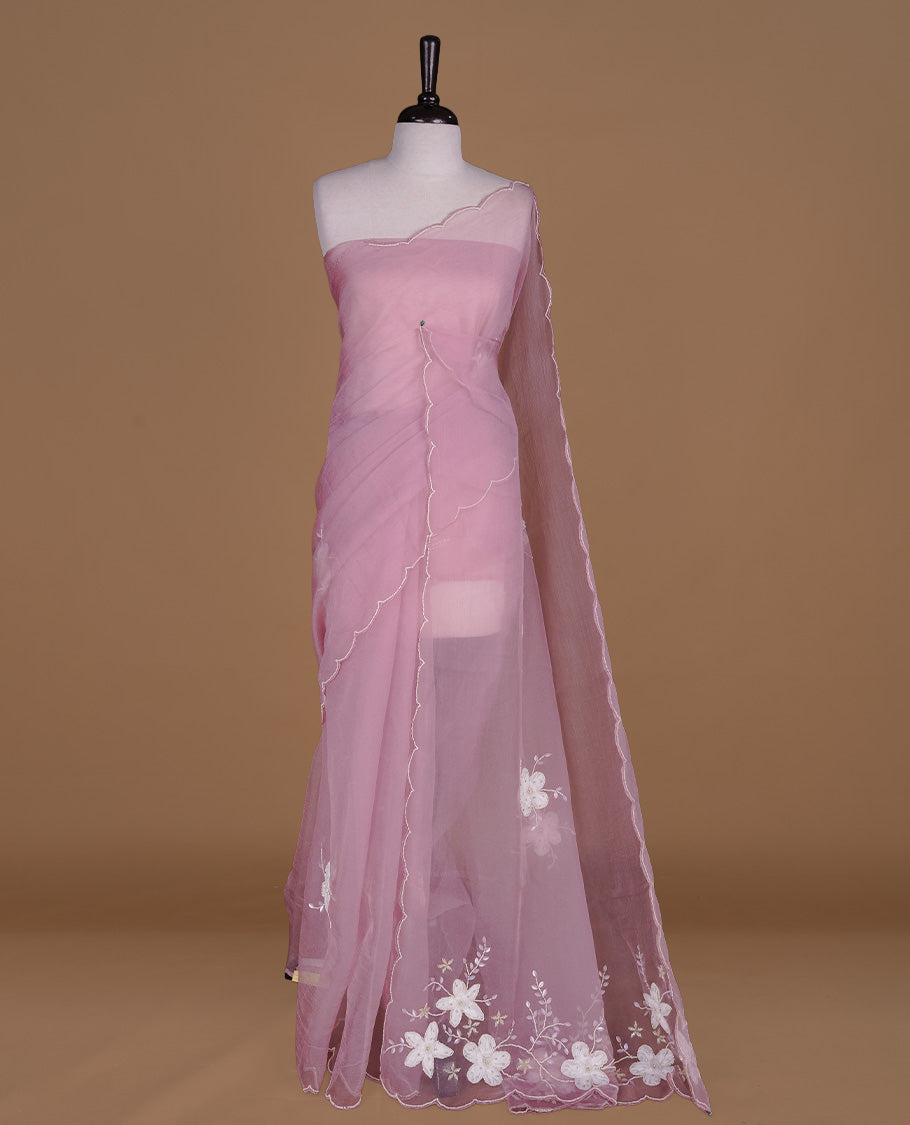 Pink colour crush organza saree featuring white floral work with beats & sequins, highlighting scalp with beats worked border, paired with matching blouse piece.