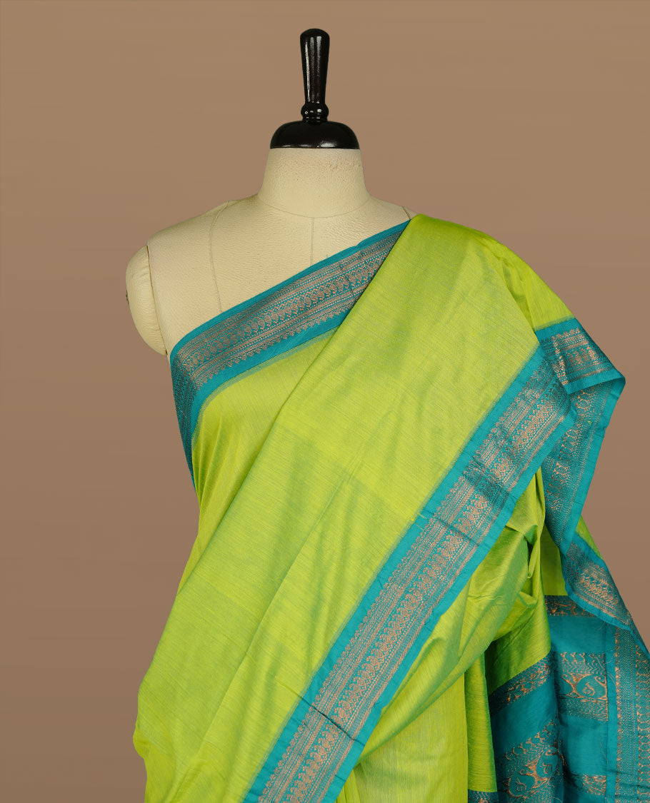 Lemon colour kalyani cotton saree featuring Elegant plain body, complemented by Aqua colour with Antique zari border, paired with matching blouse piece.