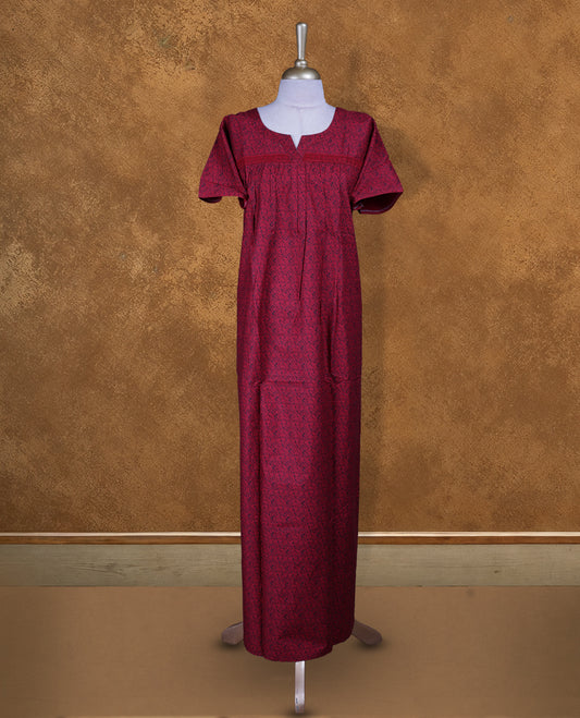 Red colour NStyle nighty features an all-over Black little floral pattern, a round neckline with a slight V-cut, short sleeves, and a full ankle-length design.