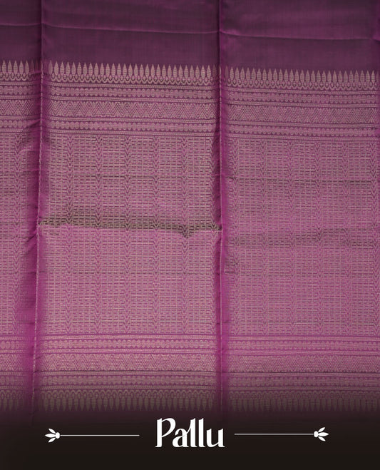 Purple colour soft silk saree featuring gold zari motifs on body, complemented by self colour with traditional  border with tassel at pallu, paired with matching blouse piece.