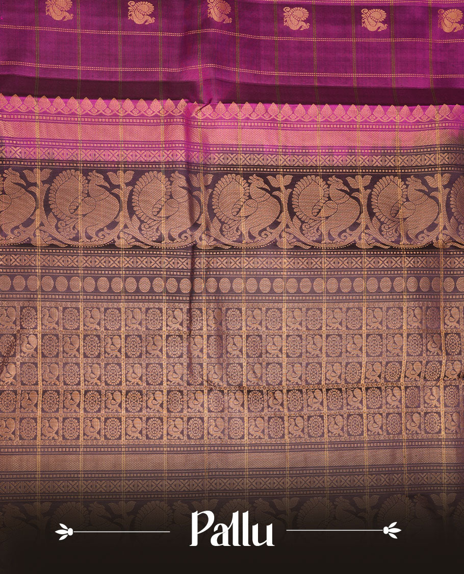Burgundy colour soft silk saree featuring elegant gold zari check across the body, complemented by a contrast deep purple with green piping on border, and paired with a matching blouse piece.