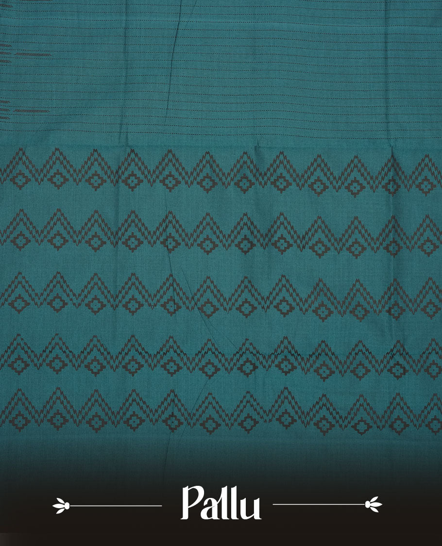 Teal Green colour poly cotton saree with black vertical dotted line pattern on the body, paired with a matching pallu featuring black zigzag geometric border, and a coordinated all‑over black stylised fleur‑de‑lis printed blouse piece.