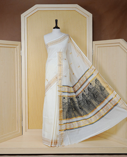 Cream Colour Cotton Kerala Saree Featuring Gold Buttas on the Body, a Classy Gold Zari Border, and a Traditional Black Colour Lord Krishna Thread work and Gold Zari Pallu, Paired with a Matching Blouse Piece.
