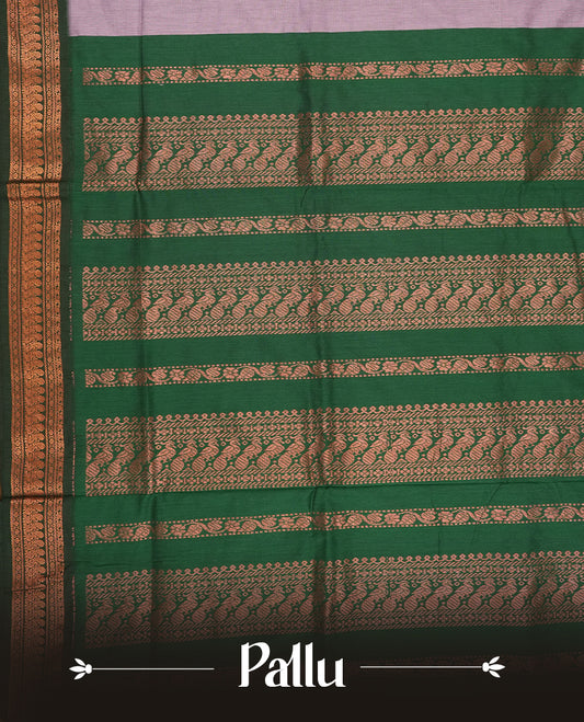 Soft Lavender colour Kalyani Cotton saree with delicate woven zari buttas all over, paired with a contrasting deep bottle green border and pallu intricately woven with rich copper zari & Comes with a matching blouse piece.